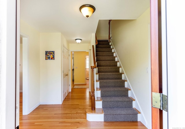 2 Cassella Dr, Wallingford, CT 06492 - stairs with wood finished floors and baseboards