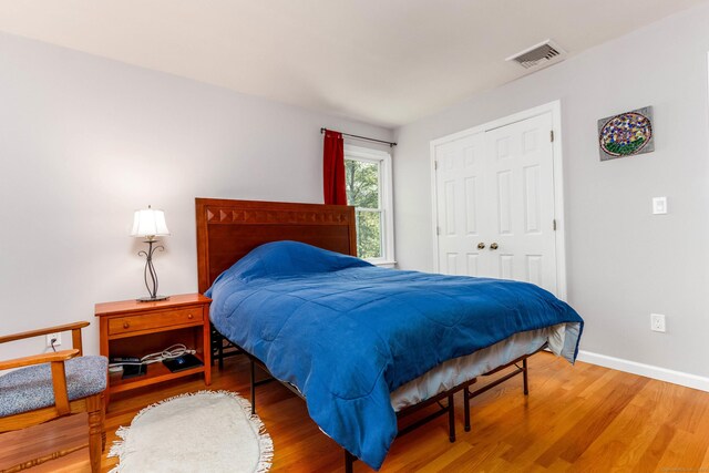2 Cassella Dr, Wallingford, CT 06492 - bedroom featuring wood finished floors, baseboards, and a closet