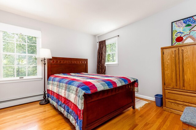 2 Cassella Dr, Wallingford, CT 06492 - bedroom with light wood-type flooring and baseboard heating