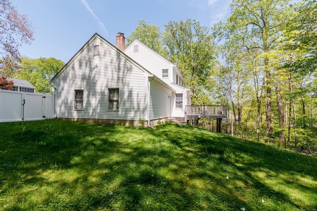 2 Cassella Dr, Wallingford, CT 06492 - rear view of house with a gate, a deck, and a chimney