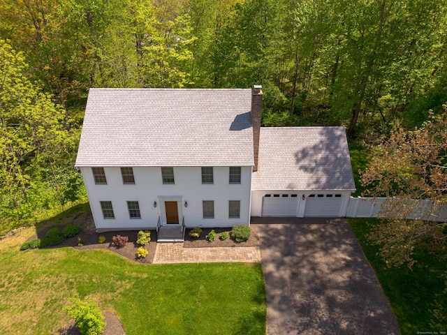 2 Cassella Dr, Wallingford, CT 06492 - colonial house with an attached garage, a chimney, driveway, a front lawn, and roof with shingles