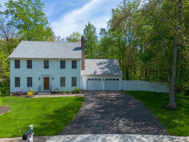 2 Cassella Dr, Wallingford, CT 06492 - colonial-style house with an attached garage, asphalt driveway, a chimney, and a gate