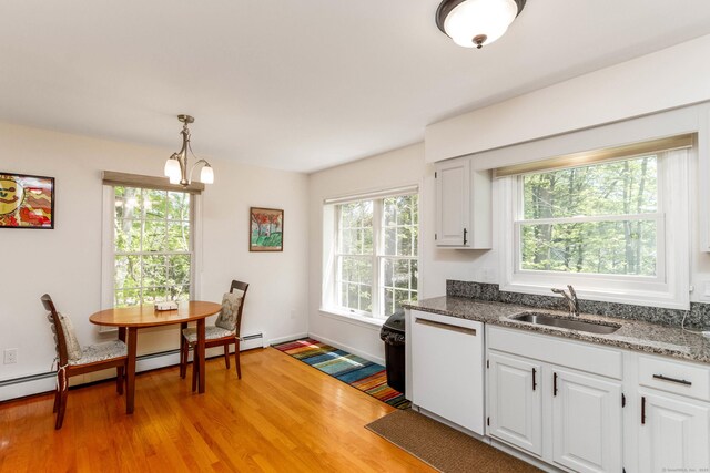 2 Cassella Dr, Wallingford, CT 06492 - kitchen featuring a sink, light wood-type flooring, dishwasher, and white cabinets