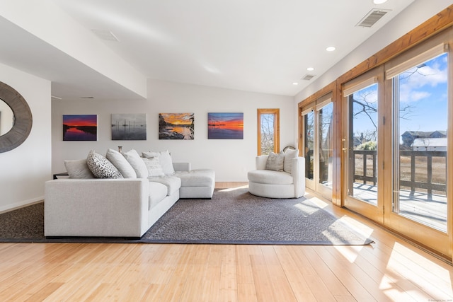 46 Wallace Rd, Branford, CT 06405 - living room featuring vaulted ceiling, wood finished floors, recessed lighting, and baseboards