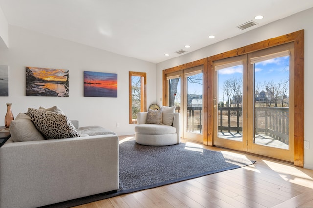46 Wallace Rd, Branford, CT 06405 - living room featuring light wood-type flooring, vaulted ceiling, and recessed lighting