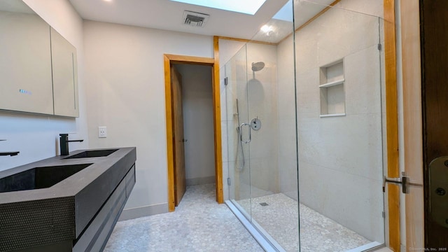 46 Wallace Rd, Branford, CT 06405 - bathroom with a stall shower, baseboards, and double vanity