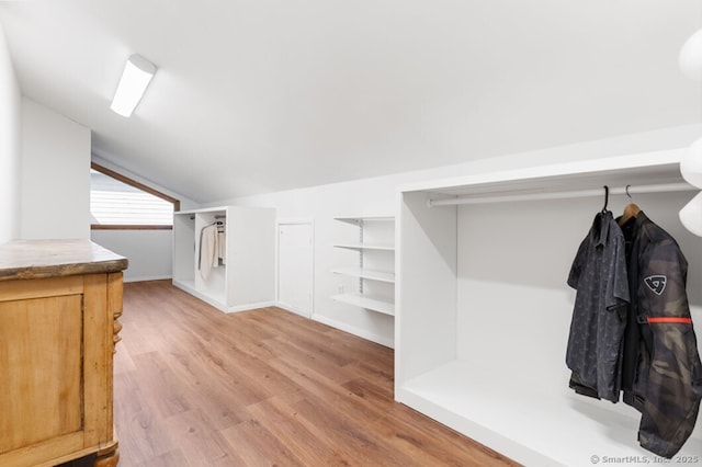 46 Wallace Rd, Branford, CT 06405 - mudroom featuring lofted ceiling, light wood-style flooring, and baseboards