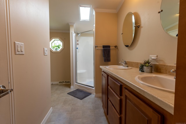 bathroom featuring a sink, a shower stall, and ornamental molding
