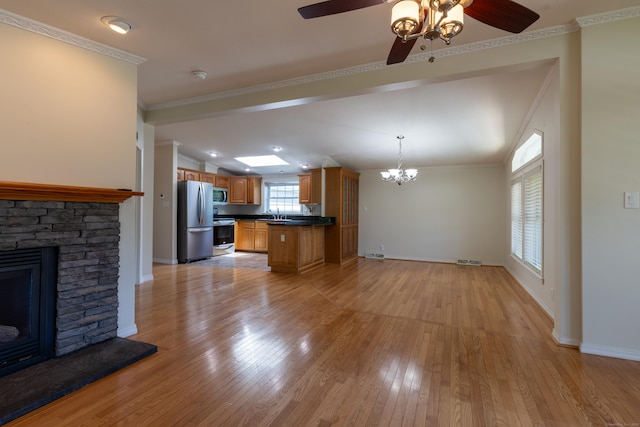 20 Cliff Rd, Ledyard, CT 06339 - kitchen with appliances with stainless steel finishes, dark countertops, ceiling fan, light wood-style floors, and a chandelier
