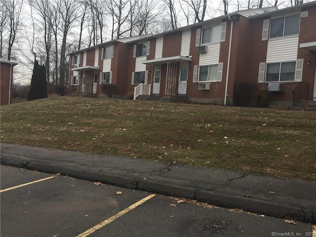 273 Queen St Apt 15E, Southington, CT 06489 - view of property featuring uncovered parking and cooling unit
