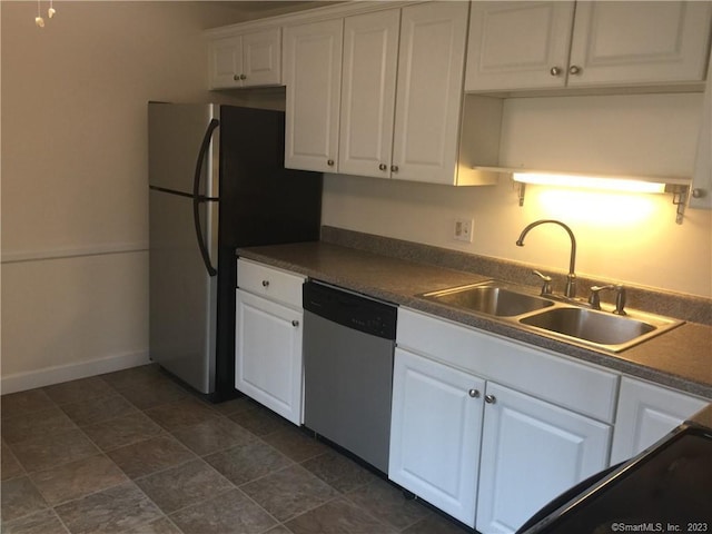 273 Queen St Apt 15E, Southington, CT 06489 - kitchen with baseboards, white cabinetry, dark countertops, stainless steel appliances, and a sink