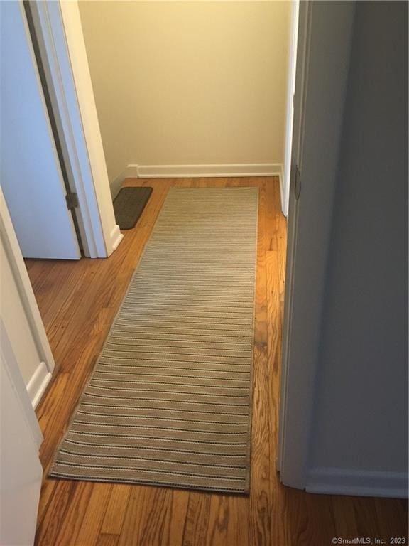 273 Queen St Apt 15E, Southington, CT 06489 - hall with baseboards and wood finished floors