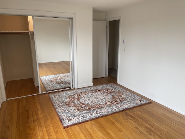 273 Queen St Apt 15E, Southington, CT 06489 - bedroom with wood finished floors and a closet