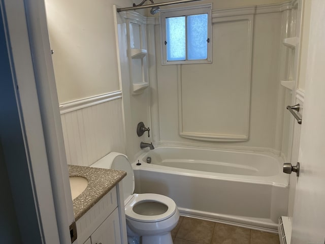 273 Queen St Apt 15E, Southington, CT 06489 - full bath featuring baseboard heating, tile patterned floors, wainscoting, shower / tub combination, and toilet