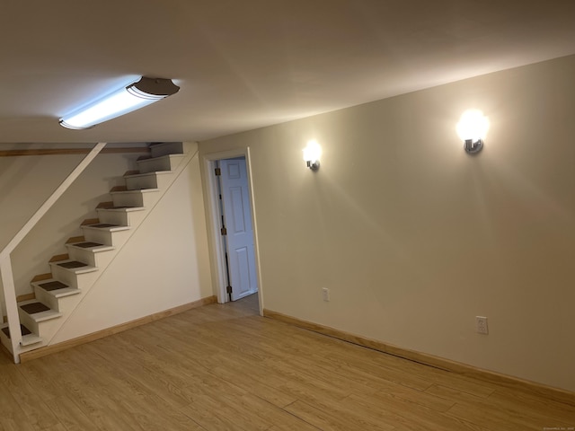 273 Queen St Apt 15E, Southington, CT 06489 - finished below grade area featuring baseboards, light wood-style floors, and stairway