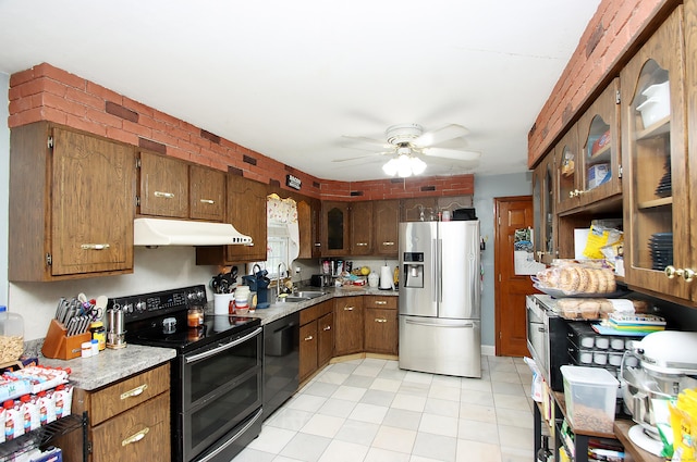 kitchen featuring a sink, stainless steel fridge with ice dispenser, dishwasher, double oven range, and under cabinet range hood