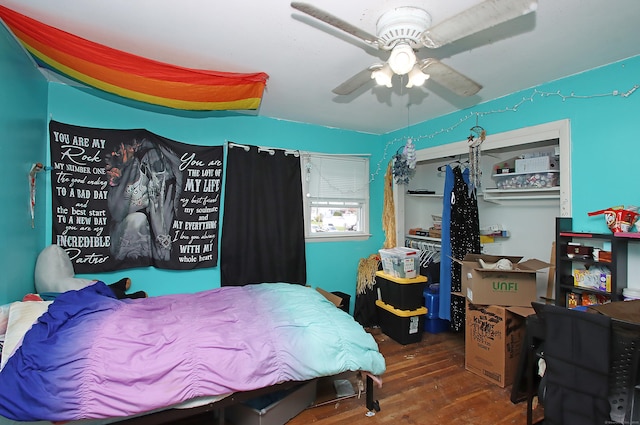 bedroom featuring ceiling fan and wood finished floors