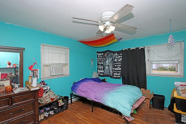 bedroom featuring cooling unit, a ceiling fan, and wood finished floors
