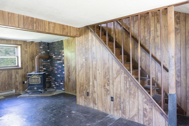 56 Laurel Hill Dr, Woodstock, CT 06282 - stairway with a wood stove, wooden walls, and baseboard heating