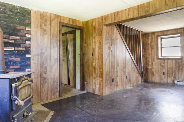 56 Laurel Hill Dr, Woodstock, CT 06282 - spare room with wood walls and a baseboard radiator
