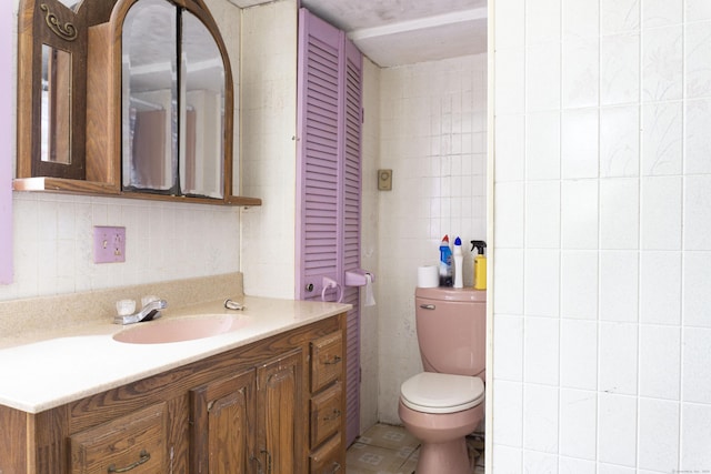 56 Laurel Hill Dr, Woodstock, CT 06282 - bathroom featuring tile walls, vanity, tasteful backsplash, and tile patterned flooring