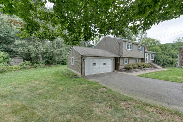 18 Black Birch Rd, Plainville, CT 06062 - view of front of home featuring a garage, driveway, and a front yard