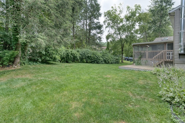 18 Black Birch Rd, Plainville, CT 06062 - view of green lawn featuring a sunroom and view of wooded area