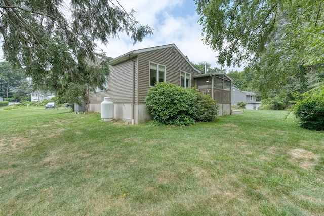 18 Black Birch Rd, Plainville, CT 06062 - view of side of property with a yard and a sunroom