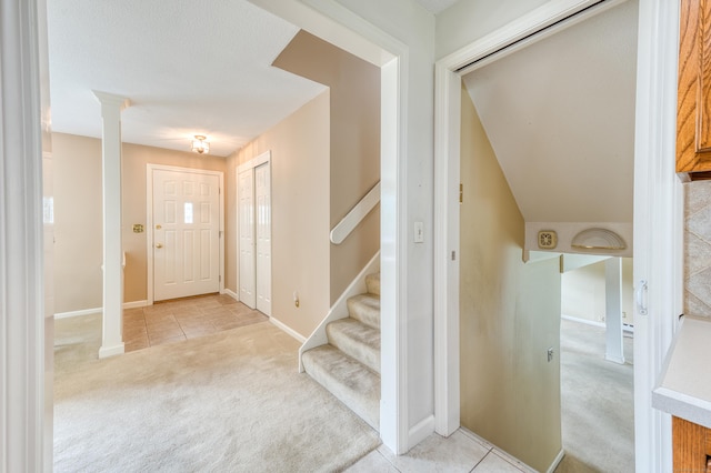 18 Black Birch Rd, Plainville, CT 06062 - foyer with light carpet, light tile patterned floors, ornate columns, and stairs