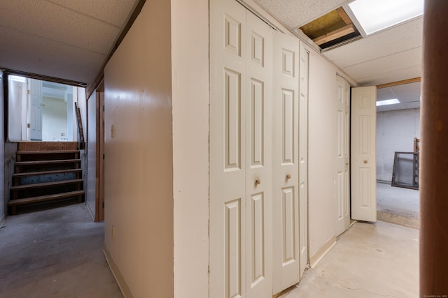 18 Black Birch Rd, Plainville, CT 06062 - hall with concrete flooring, a drop ceiling, and stairs