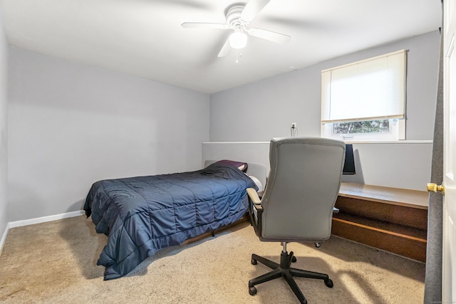 carpeted bedroom with baseboards and ceiling fan