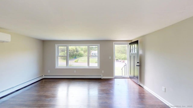 3 Richard Ln, Prospect, CT 06712 - spare room featuring baseboard heating, dark wood finished floors, and a wall unit AC