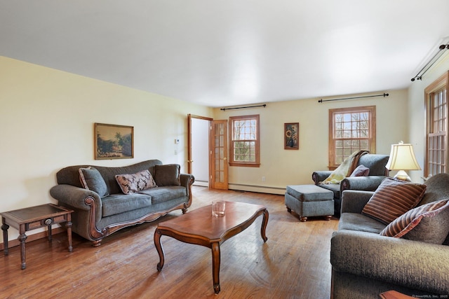 1069 Black Rock Tpke, Easton, CT 06612 - living room featuring light wood-style floors, a baseboard heating unit, and baseboard heating