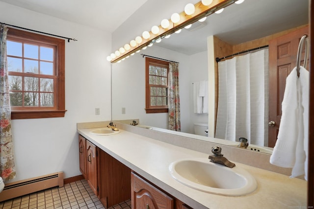 1069 Black Rock Tpke, Easton, CT 06612 - full bath featuring a sink, a baseboard radiator, and a wealth of natural light