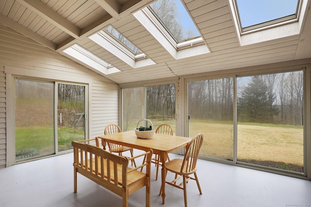 1069 Black Rock Tpke, Easton, CT 06612 - sunroom featuring finished concrete flooring, wooden walls, and lofted ceiling with skylight