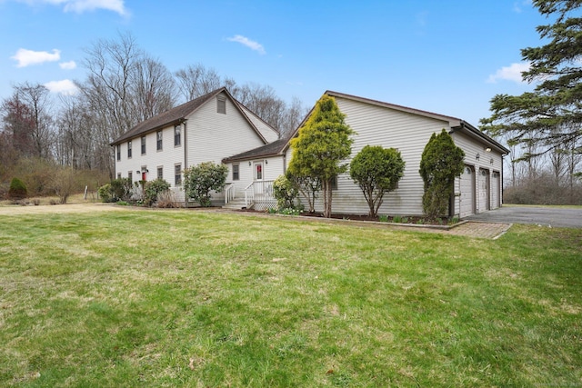 1069 Black Rock Tpke, Easton, CT 06612 - view of side of home featuring a yard, a garage, and aphalt driveway
