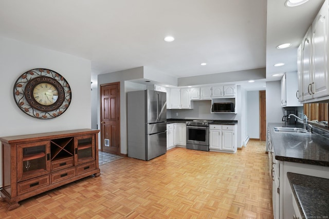 1069 Black Rock Tpke, Easton, CT 06612 - kitchen with recessed lighting, a sink, white cabinetry, and stainless steel appliances