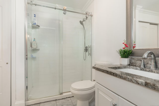 bathroom with a shower stall, vanity, ornamental molding, and toilet