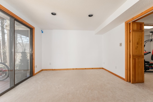 empty room with baseboards and carpet floors