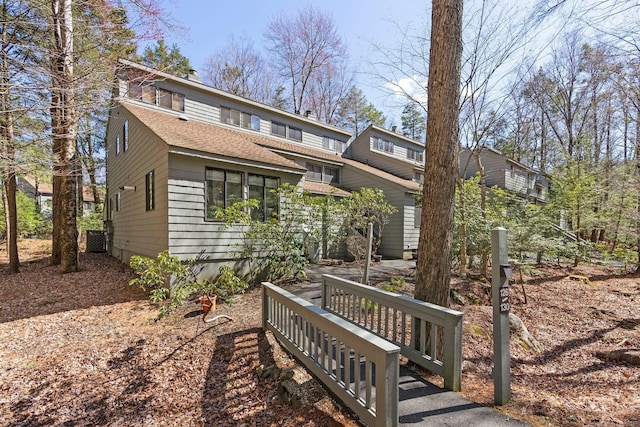 view of front of home with a shingled roof