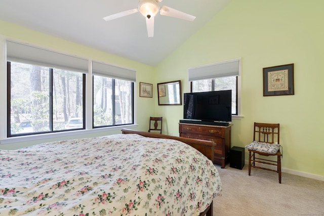 bedroom featuring light carpet, high vaulted ceiling, baseboards, and ceiling fan