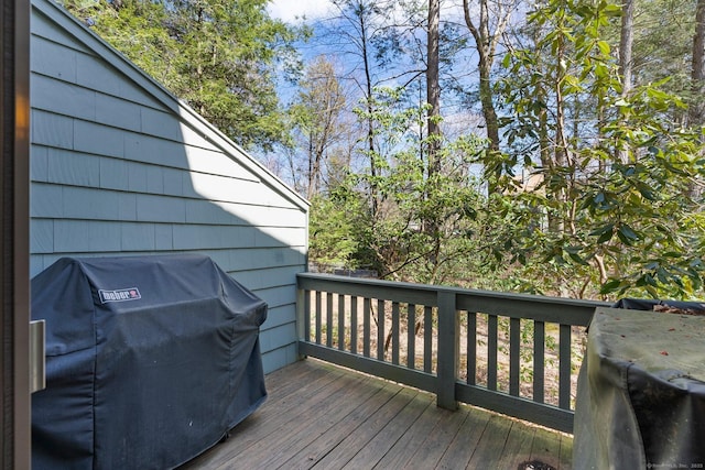 wooden deck featuring grilling area