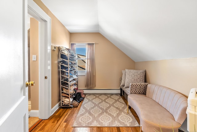 161 Boswell St, Stratford, CT 06615 - sitting room featuring wood finished floors, a baseboard heating unit, baseboards, and lofted ceiling