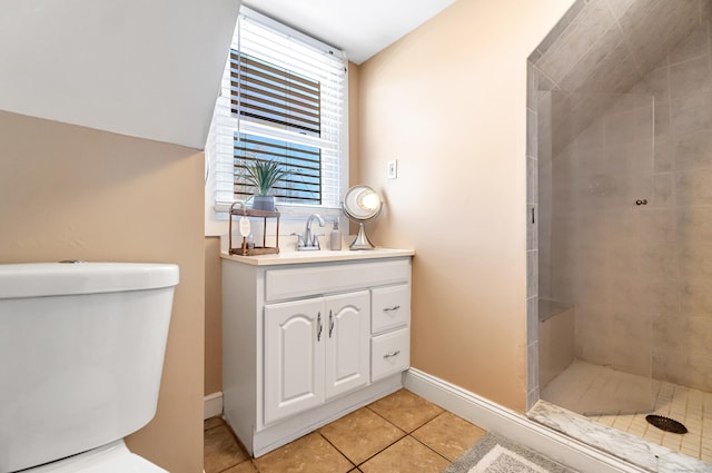 161 Boswell St, Stratford, CT 06615 - full bath with a tile shower, vanity, toilet, tile patterned floors, and baseboards