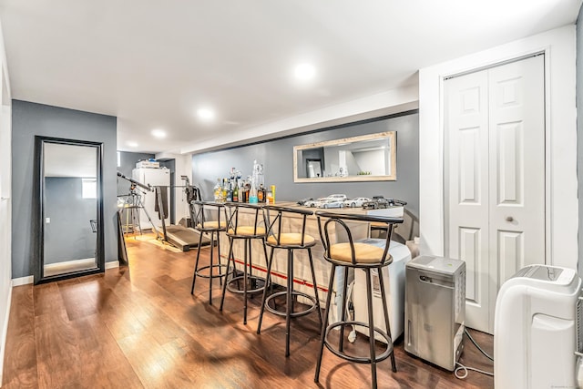 161 Boswell St, Stratford, CT 06615 - bar with a bar, baseboards, and wood finished floors