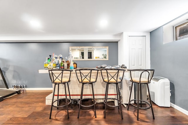 161 Boswell St, Stratford, CT 06615 - bar featuring a bar, baseboards, and wood finished floors