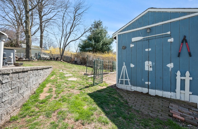 61 Harrington St, Meriden, CT 06451 - view of yard with a shed, fence, and an outdoor structure