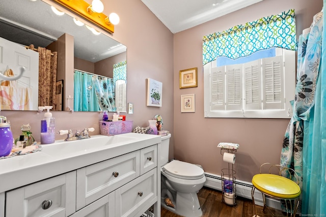 61 Harrington St, Meriden, CT 06451 - bathroom with vanity, toilet, and wood finished floors