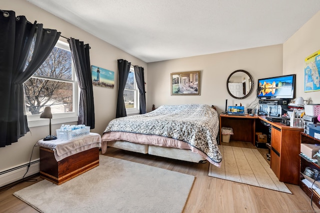 61 Harrington St, Meriden, CT 06451 - bedroom with baseboard heating and wood finished floors