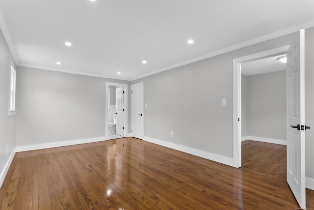 unfurnished room featuring baseboards, recessed lighting, and wood finished floors